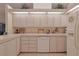 Well-equipped kitchen with white cabinets and modern appliances at 8225 Sw 108Th Loop, Ocala, FL 34481