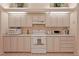 Kitchen features white cabinets, updated appliances, and ample counter space at 8225 Sw 108Th Loop, Ocala, FL 34481