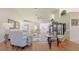 Spacious living room with hardwood floors and cozy seating at 8225 Sw 108Th Loop, Ocala, FL 34481