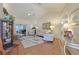 Bright living room with hardwood floors, comfy seating, and large windows at 8225 Sw 108Th Loop, Ocala, FL 34481