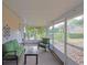 Relaxing screened porch with comfortable seating and views of backyard at 8225 Sw 108Th Loop, Ocala, FL 34481