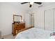 Bedroom with a wooden dresser, double bed, and ample closet space at 9646 Sw 92 Place Rd, Ocala, FL 34481