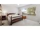 Spacious bedroom with a wooden bed frame and ample closet space at 9646 Sw 92 Place Rd, Ocala, FL 34481