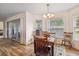 Dining area with wooden table and chairs, plus a corner window at 9646 Sw 92 Place Rd, Ocala, FL 34481