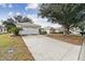 House exterior with a driveway and landscaping at 9646 Sw 92 Place Rd, Ocala, FL 34481