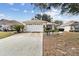 Front view of a single-story house with a garage at 9646 Sw 92 Place Rd, Ocala, FL 34481