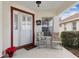 Front porch with chairs and festive holiday decor at 9646 Sw 92 Place Rd, Ocala, FL 34481