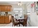 Kitchen nook with wooden table and chairs, offering a bright space for meals at 9646 Sw 92 Place Rd, Ocala, FL 34481