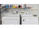 Laundry room with washer, dryer, and shelving for storage at 9646 Sw 92 Place Rd, Ocala, FL 34481