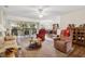 Spacious living room with comfy seating and access to patio at 9646 Sw 92 Place Rd, Ocala, FL 34481