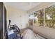 Relaxing screened porch with patio furniture and view of the backyard at 9646 Sw 92 Place Rd, Ocala, FL 34481