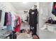 Large walk-in closet with double hanging rods and shelving at 9646 Sw 92 Place Rd, Ocala, FL 34481
