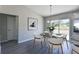 Bright dining room with table, chairs, and view to backyard at 115 Guava Place Dr, Ocklawaha, FL 32179