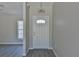 Entryway with white door and light gray walls at 115 Guava Place Dr, Ocklawaha, FL 32179