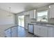 Modern kitchen with sink, dishwasher and granite countertops at 115 Guava Place Dr, Ocklawaha, FL 32179