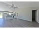 Modern kitchen with gray cabinets, granite countertops, and stainless steel appliances at 115 Guava Place Dr, Ocklawaha, FL 32179
