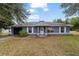 Blue house with white shutters and a grassy yard at 15509 Sw 34Th Court Rd, Ocala, FL 34473