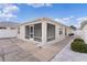 Enclosed screened porch with adjacent walkway at 1673 Belle Grove Dr, The Villages, FL 32162