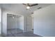 Bedroom with mirrored closet doors and ceiling fan at 16919 Sw 27Th Ave, Ocala, FL 34473
