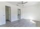 Bright bedroom with vinyl flooring, ceiling fan, and en-suite bathroom at 16919 Sw 27Th Ave, Ocala, FL 34473