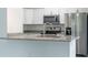 Modern kitchen with stainless steel appliances and granite countertops at 16919 Sw 27Th Ave, Ocala, FL 34473