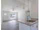 Bright and airy living room with vinyl plank flooring and view to backyard at 16919 Sw 27Th Ave, Ocala, FL 34473