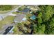 Aerial view of a house with a backyard, pool, and wooden fence at 17006 Sw 39Th Cir, Ocala, FL 34473