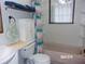 Bathroom with tub and updated vanity at 17935 Se 10Th Pl, Silver Springs, FL 34488