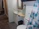 Bathroom with toilet and updated vanity at 17935 Se 10Th Pl, Silver Springs, FL 34488