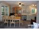 Dining area with wood table and chairs near kitchen at 17935 Se 10Th Pl, Silver Springs, FL 34488