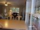 Bright dining area with view into living room and screened porch at 17935 Se 10Th Pl, Silver Springs, FL 34488