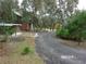Gravel driveway leading to house and backyard at 17935 Se 10Th Pl, Silver Springs, FL 34488