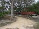 Dirt driveway leading to house with trees at 17935 Se 10Th Pl, Silver Springs, FL 34488