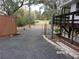 Gravel driveway with a view of the property's surroundings at 17935 Se 10Th Pl, Silver Springs, FL 34488