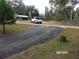 Gravel driveway leading to house and street at 17935 Se 10Th Pl, Silver Springs, FL 34488