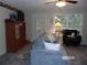 Cozy living room featuring comfortable seating and large window at 17935 Se 10Th Pl, Silver Springs, FL 34488