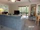 Living room with sectional sofa and sliding glass doors at 17935 Se 10Th Pl, Silver Springs, FL 34488