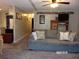 Comfortable living room with gray sofa and built-in shelving at 17935 Se 10Th Pl, Silver Springs, FL 34488