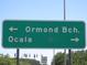 Road sign indicating directions to Ormond Beach and Ocala at 17935 Se 10Th Pl, Silver Springs, FL 34488