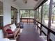 Peaceful screened porch offers a relaxing outdoor space at 17935 Se 10Th Pl, Silver Springs, FL 34488