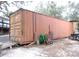 Large shipping container with various items stored outside at 17935 Se 10Th Pl, Silver Springs, FL 34488