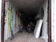 Shipping container converted into a workshop with various tools and a motorcycle at 17935 Se 10Th Pl, Silver Springs, FL 34488
