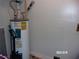 Water heater closet with Rheem water heater at 17935 Se 10Th Pl, Silver Springs, FL 34488