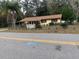 House with mature trees and a paved driveway at 1855 Ne 23Rd St, Ocala, FL 34470