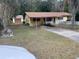 Ranch-style house with carport and fenced yard at 1855 Ne 23Rd St, Ocala, FL 34470