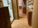 Hallway with wood flooring leading to kitchen at 1855 Ne 23Rd St, Ocala, FL 34470
