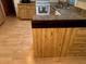 Kitchen corner with wood cabinets and laminate flooring at 1855 Ne 23Rd St, Ocala, FL 34470