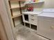 Laundry room with washer, dryer, and shelving at 1855 Ne 23Rd St, Ocala, FL 34470