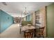 Bright dining room with a chandelier and built-in shelving at 1918 Ne 9Th St, Ocala, FL 34470