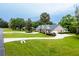 Aerial view of house with circular driveway and landscaping at 1945 Sw 40Th Pl, Ocala, FL 34471
